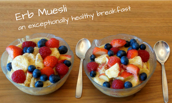 Two bowls Erb-Muesli on wooden table - lettering "a particularly healthy breakfast".