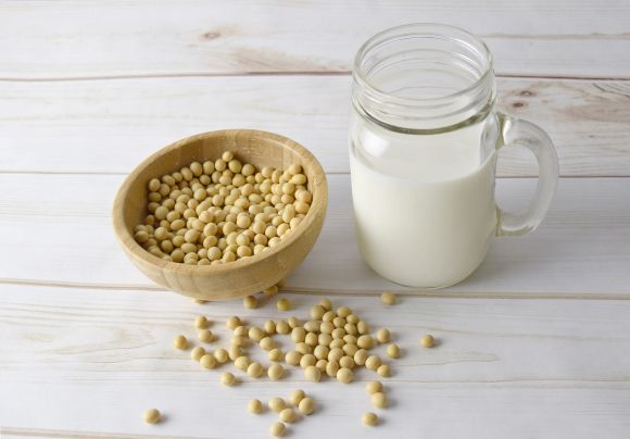 Left bowl with soybeans, right pitcher with soy milk. Left bowl with soybeans, right pitcher with soy milk.