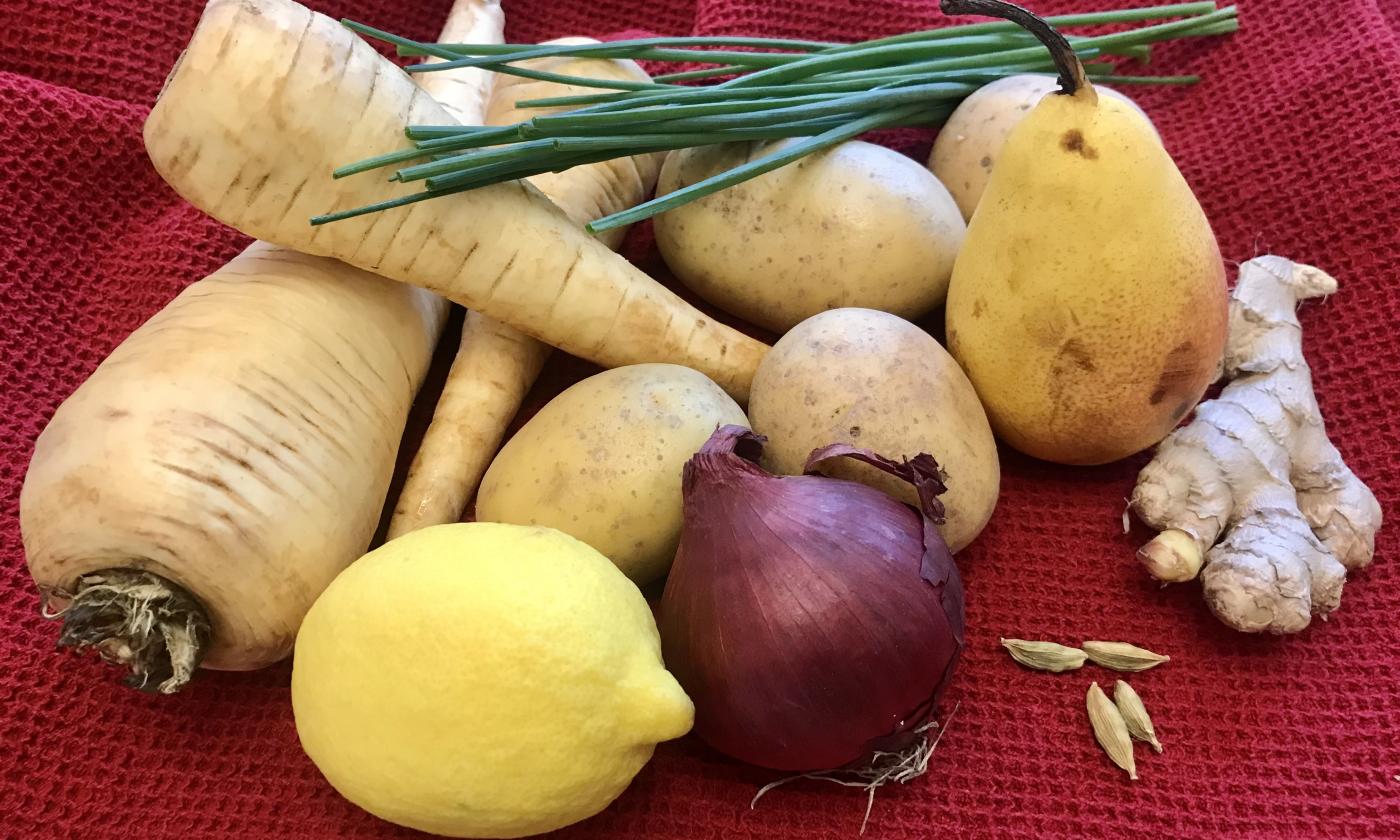 Preparing the ingredients for the "parsnip-potato puree" on a red cloth.