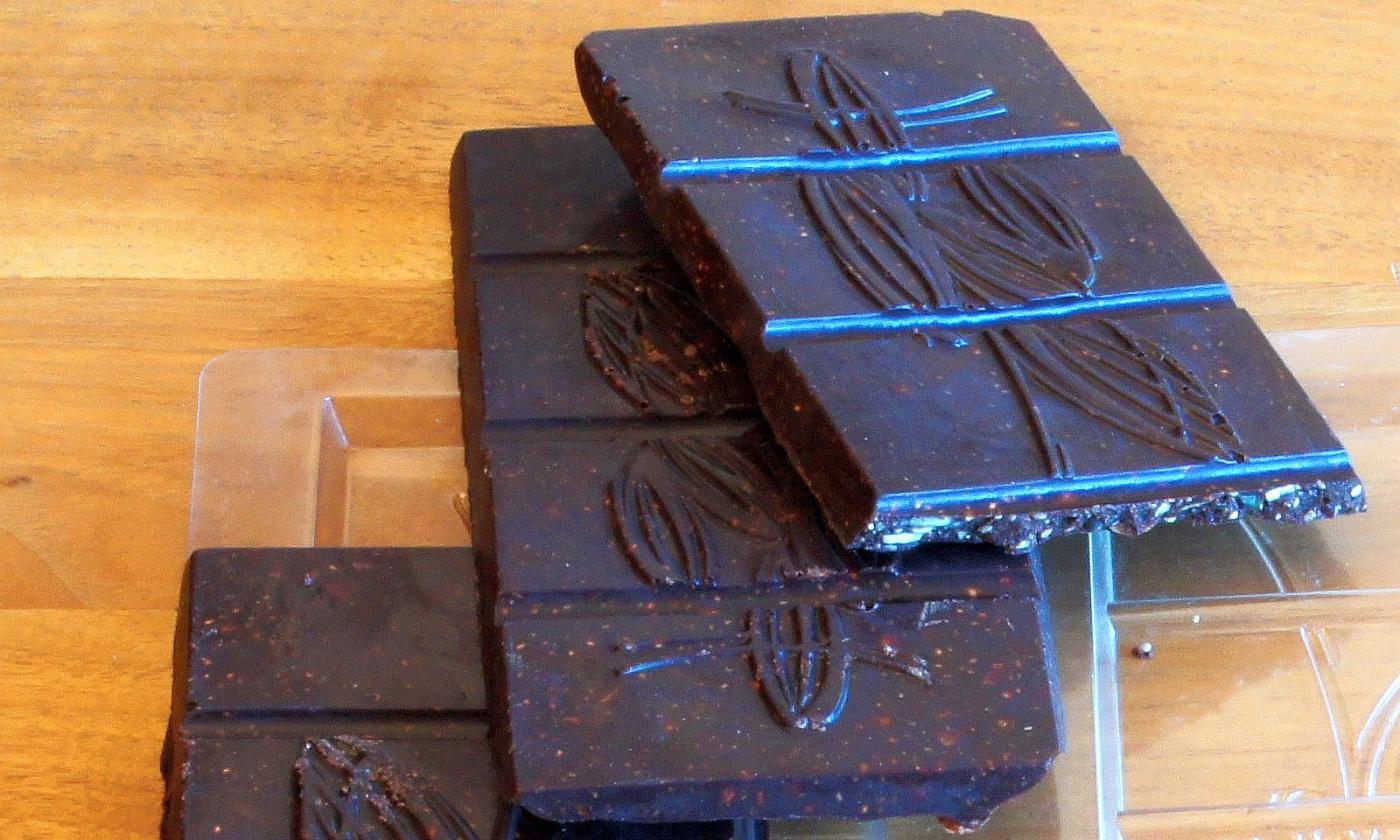 Ready-made, raw vegan chocolate. After cooling, the raw chocolate can be easily removed from the mold.