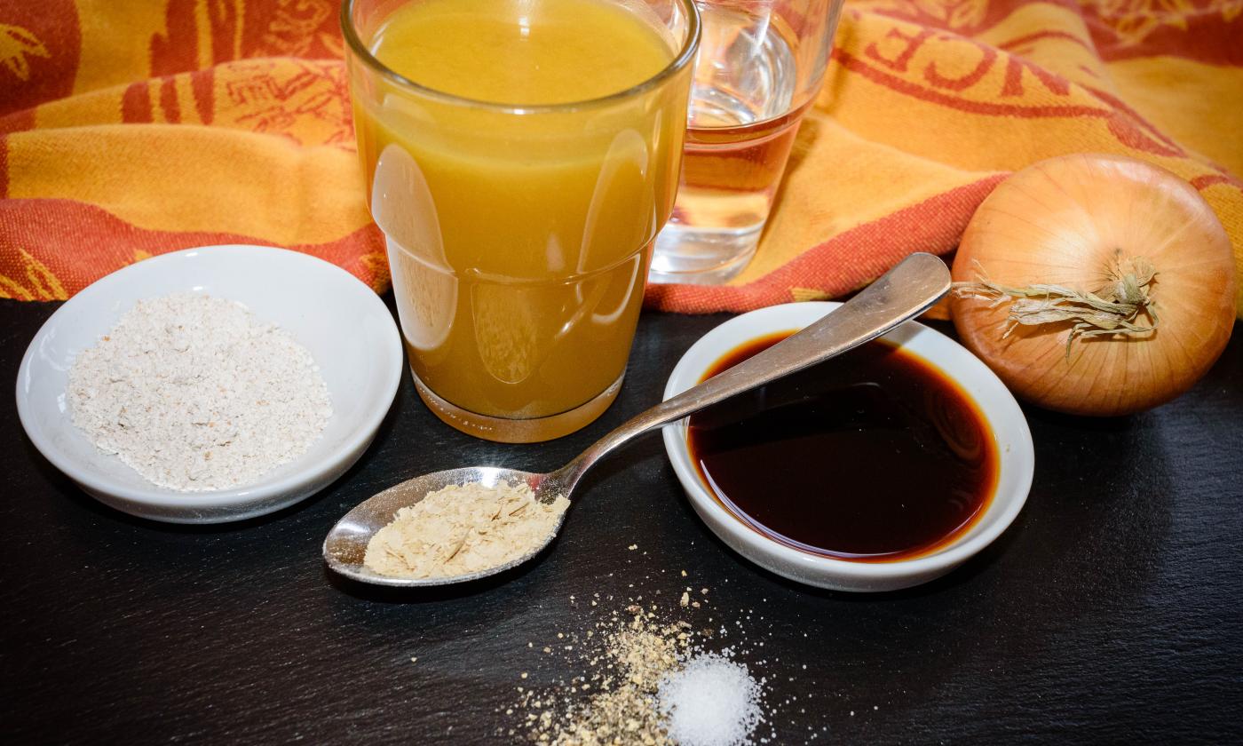 Preparing the ingredients for the "Simple Vegan Gravy" on a dark table.
