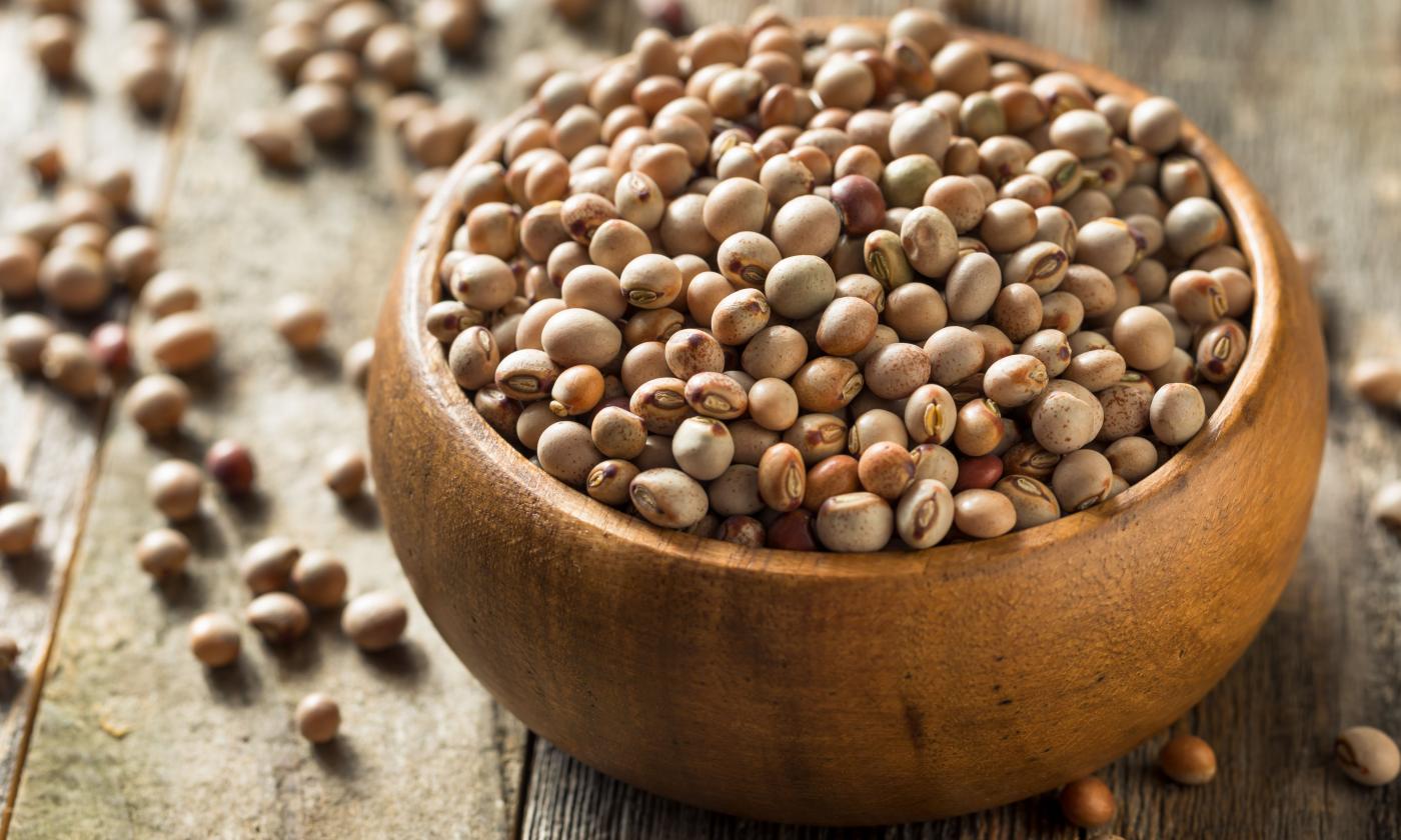 Ripe raw pigeon peas (red gram) in wooden bowl - Cajanus cajan. Ripe raw pigeon peas (red gram) in wooden bowl - Cajanus cajan.