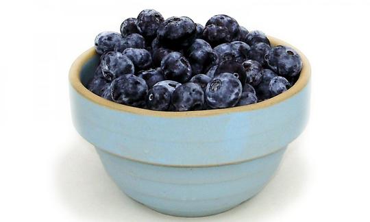 Raw blueberries - Vaccinium spp. - in a clay bowl. Raw blueberries - Vaccinium spp. - in a clay bowl.