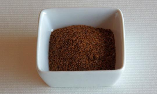 Chili powder in a bowl. Chili powder is popular in American, Mexican, and Spanish cuisines.