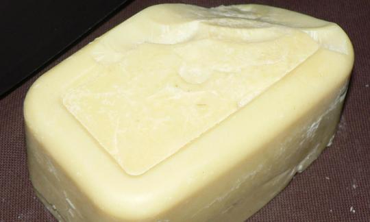 Block of cocoa butter, pale yellow to light yellow in color. Block of cocoa butter, pale yellow to light yellow in color.