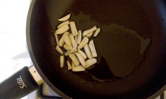 Garlic with oil in a skillet
