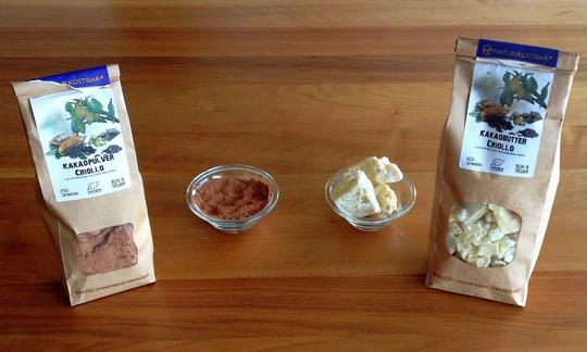 On the left, cocoa powder in a bag and bowl, on the right, cocoa butter as the main ingredients for raw chocolate.