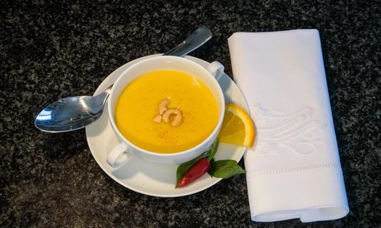 Ready-made and prepared "Fiery pumpkin soup with ginger and coconut milk". (Viewed from above)
