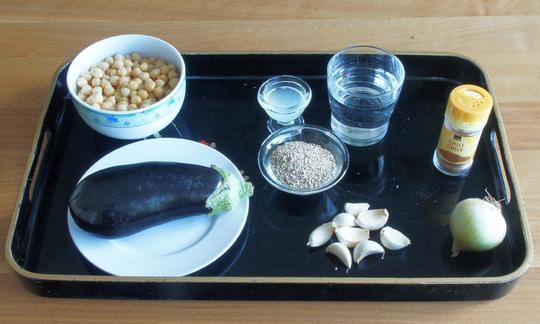 Mise en place for the eggplant hummus: ingredients prepared for the recipe
