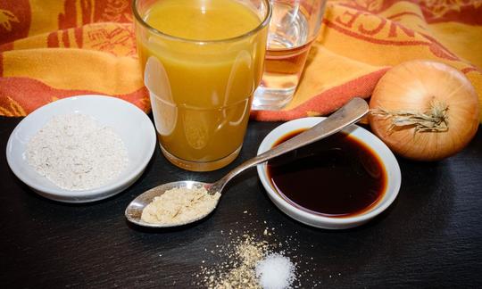 Preparing the ingredients for the "Simple Vegan Gravy" on a dark table.