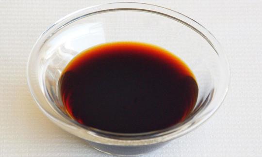Soy sauce in a glass dish. Soy sauce is mainly used in Asian dishes. As a marinade, it gives tofu a nice savory taste. Soy sauce in a glass bowl: The soy sauce is used primarily as an ingredient for Asian dishes.