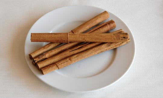 Paper-thin Ceylon Cinnamon sticks from Sri Lanka on a plate; Ceylon cinnamon has a sweet flavor. Paper-thin Ceylon Cinnamon sticks from Sri Lanka on a plate; Ceylon cinnamon has a sweet flavor.