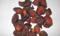 Dried, unsulphured plums, which are usually darker in color.