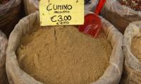 Ground cumin seeds (Cuminum cyminum) in a large sack.