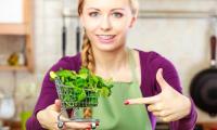 Fresh lamb's lettuce in a mini shopping trolley - Valerianella locusta.