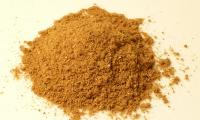 Garam masala - an Indian spice mixture - piled up on a whitish surface.