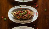 Stuffed Eggplant with Nut and Pomegranate Filling (Gefüllte Auberginen mit Nuss-Granatapfelfüllung) from Vegan Oriental (East Asian vegan cuisine), p. 37