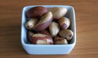 Dried Brazil nuts in a dish. Brazil nuts are the seeds of the fruit of the Brazil nut tree.