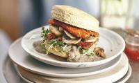 Recipe photo for "Button Up White Bean Gravy", shown with a burger, from “Protein Ninja”, p. 59