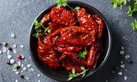 Sun-dried tomato halves with salt and spices in shell - Solanum lycopersicum.