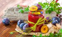 Prune plums and jam in jar - Prunus domestica subsp. domes