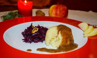 Ready-made "Winter vegan gravy with dried plums" on a white plate. Ready-made "Winter vegan gravy with dried plums" on a white plate.